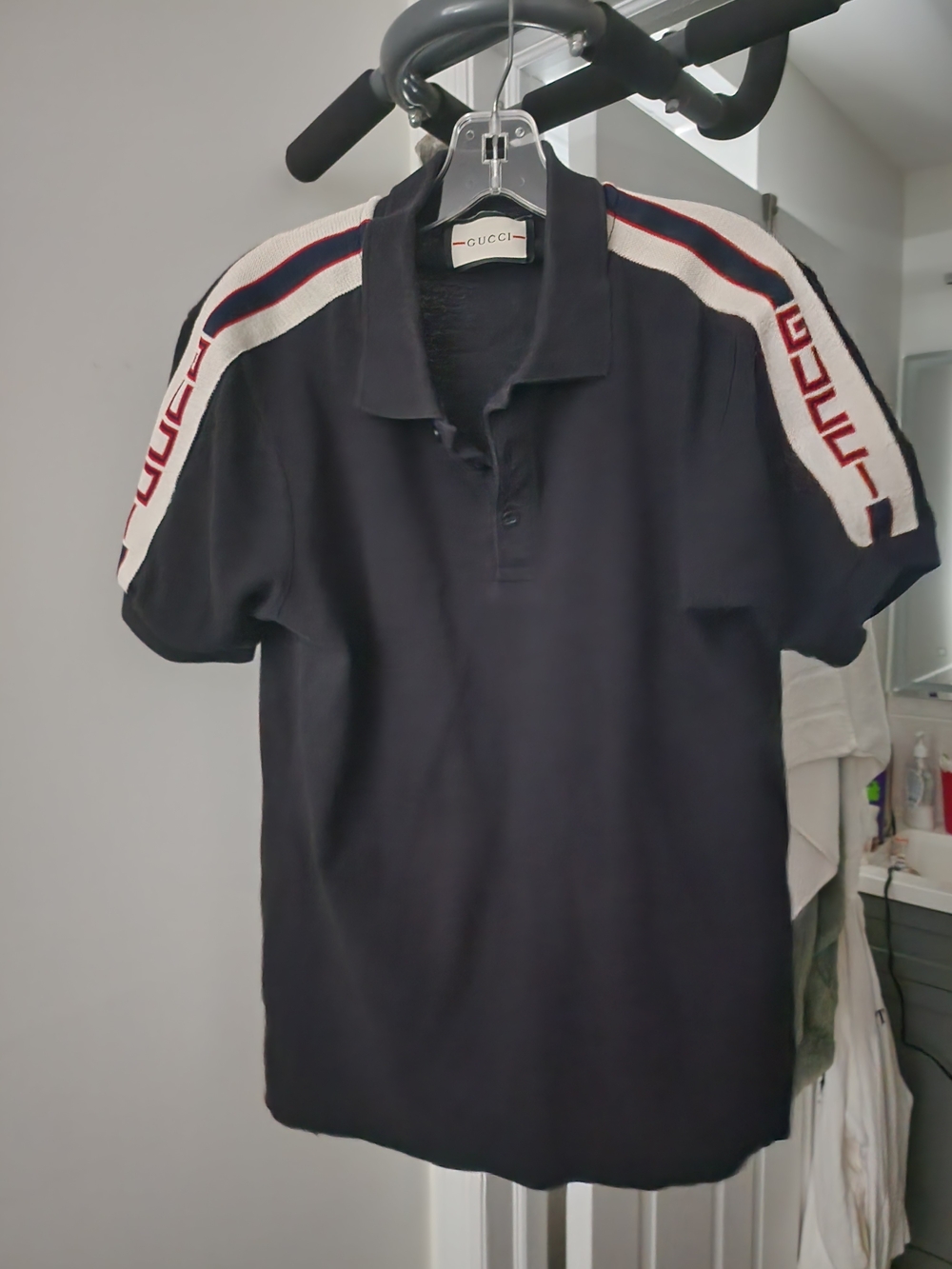 Black Polo with White and Red Shoulder Bands. S-M